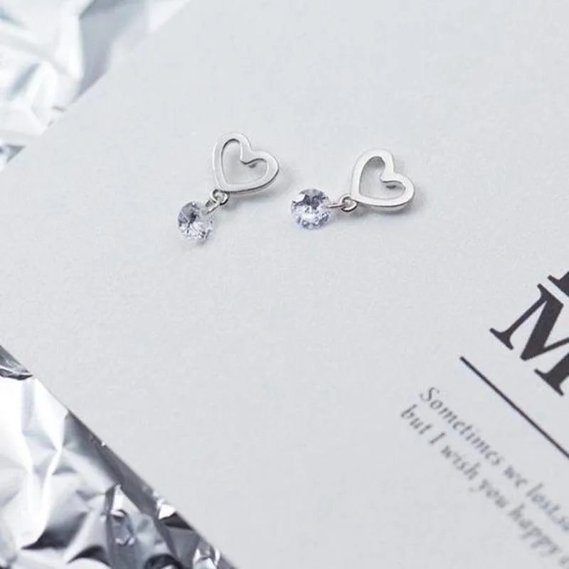 Swaying Solitaire On Heart Minimal Studs